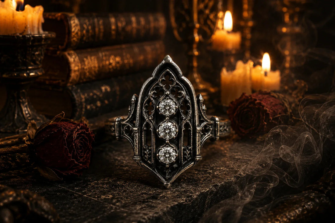 Oxidized 925 sterling silver Gothic cathedral ring on a dark stone altar in candlelight
