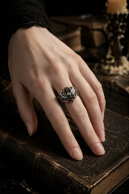 Baroque Raven Crest Ring worn on hand, raven crest with baroque gold scrollwork