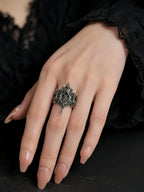 Basilica Rosette Ring worn on the hand, close-up of the rose window crown