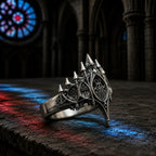Basilica Rosette Ring three-quarter angle on a stone ledge with cathedral stained glass