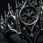Gothic rose window ring close-up — chiaroscuro hand-oxidized patina within blind arcades and rose window petals