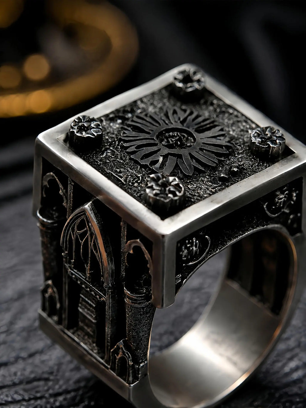 Close-up of the Lord's Signet ring showing the rose window top and lancet cathedral window carved on the side