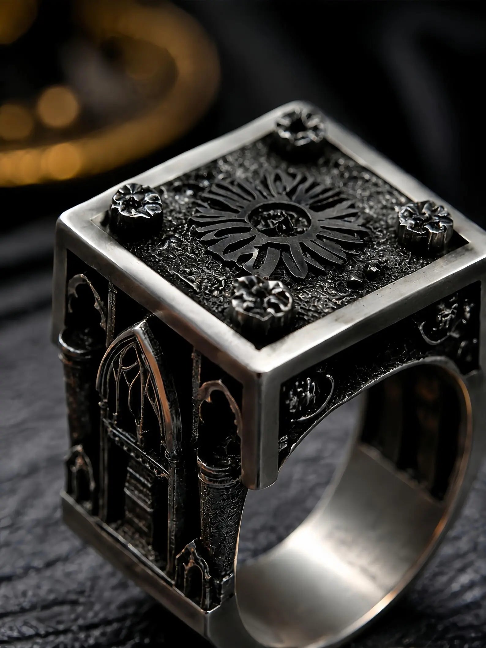 Close-up of the Lord's Signet ring showing the rose window top and lancet cathedral window carved on the side