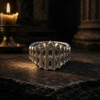 Cathedral Arcade Ring in oxidized sterling silver on a stone altar beside a candle