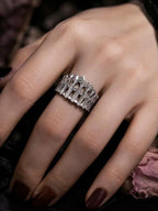 Cathedral Arcade Ring worn on a hand, showing the arcade band from above