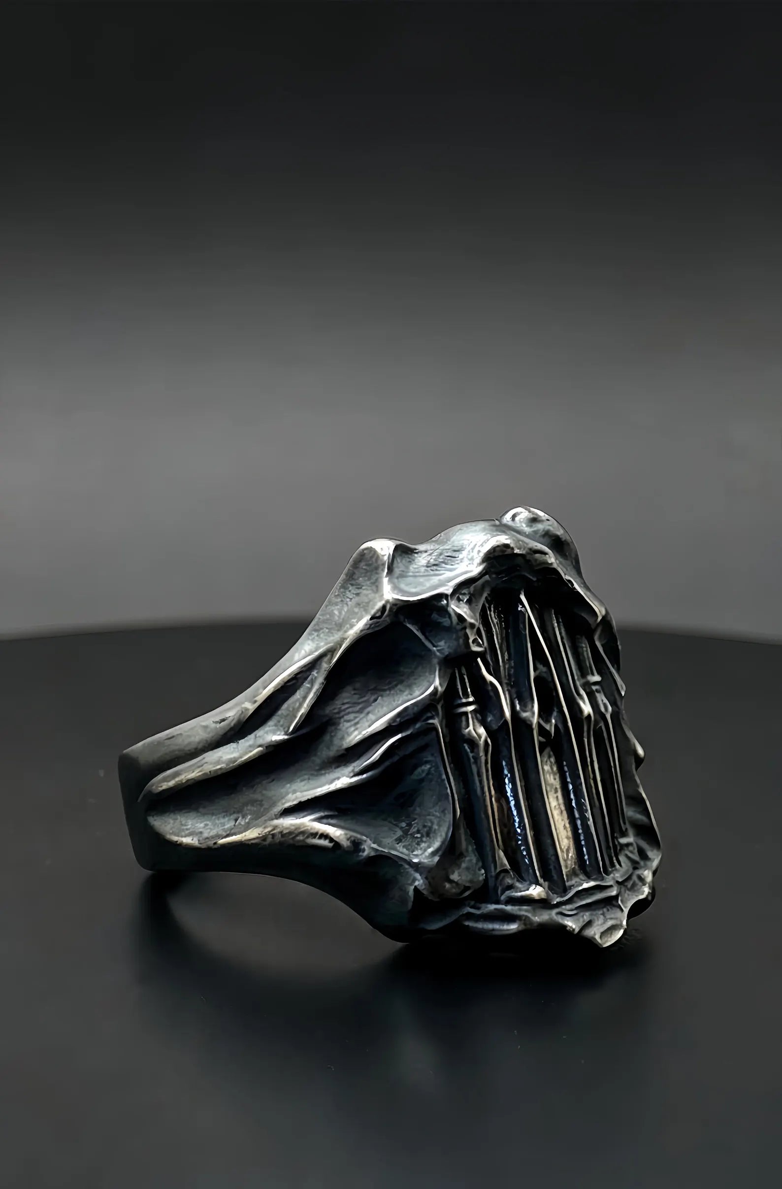 Dark Cathedral Ring side profile — raw textured oxidized sterling silver band
