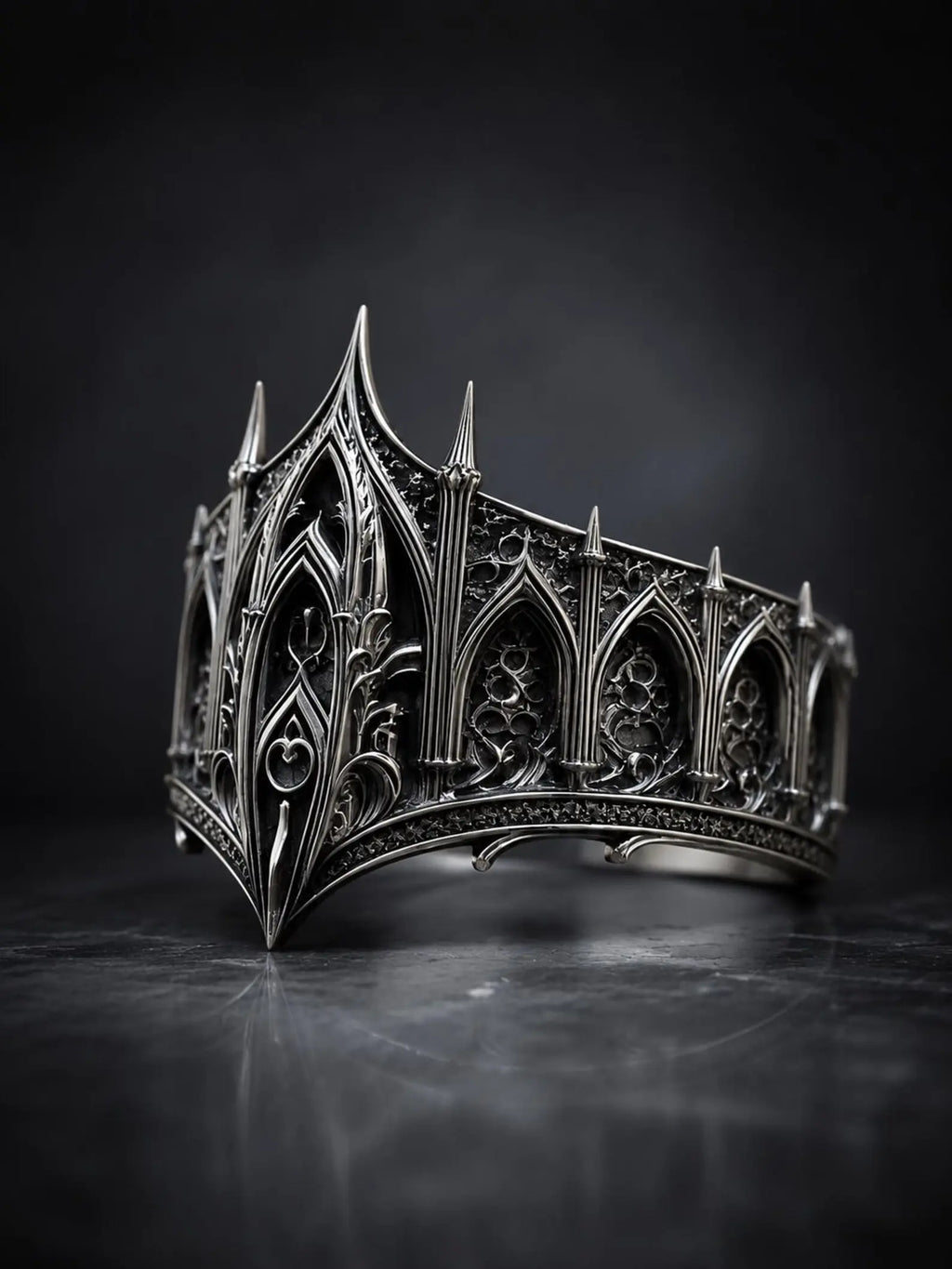 Cathedral spire crown ring close-up — micro-pinnacles and gothic lancet arches in sterling silver