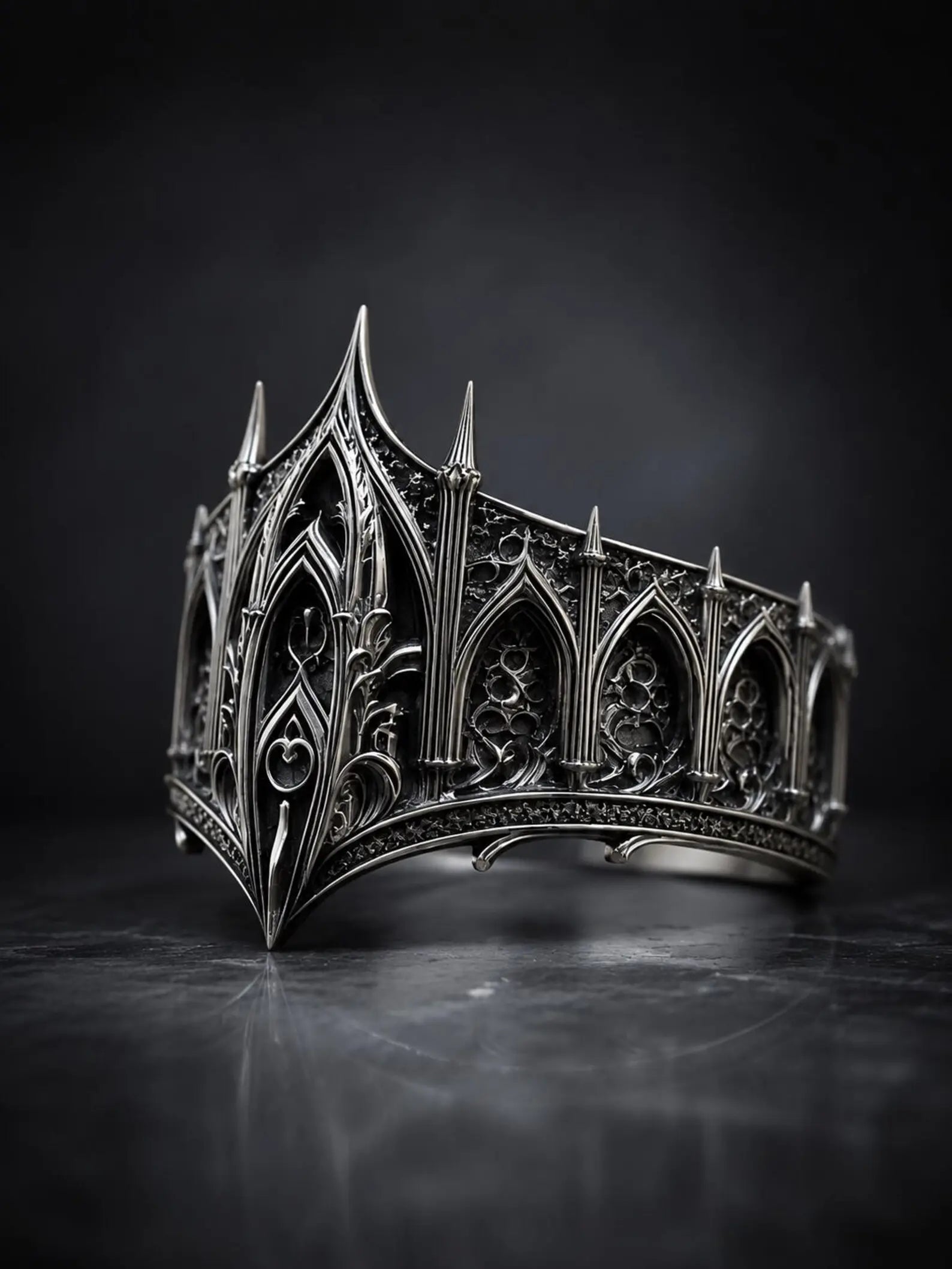 Cathedral spire crown ring close-up — micro-pinnacles and gothic lancet arches in sterling silver