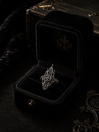 Mirrored cathedral spire ring — gothic cross medallion and towering lancet arches reflected in 925 sterling silver