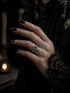 Hand wearing gothic marquise spire ring with white topaz — Dark Academia statement piece, handcrafted silver