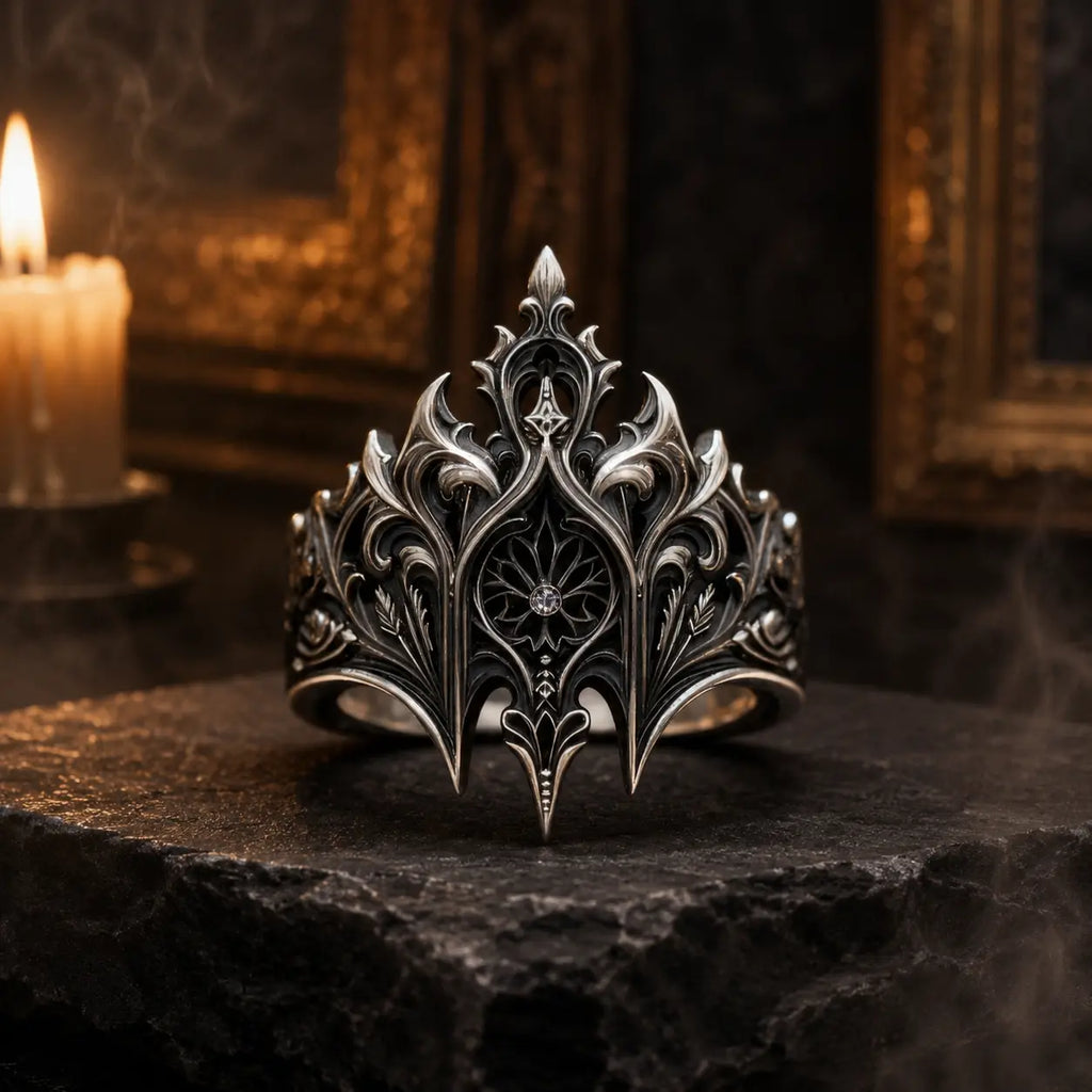 Elven Crown Ring in oxidized sterling silver on a stone altar beside a candle