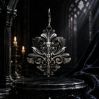 Spine motif dangle earring in oxidized sterling silver, hanging close-up