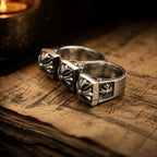 Double Fleur-de-Lis Ring displayed in gothic-style jewelry box