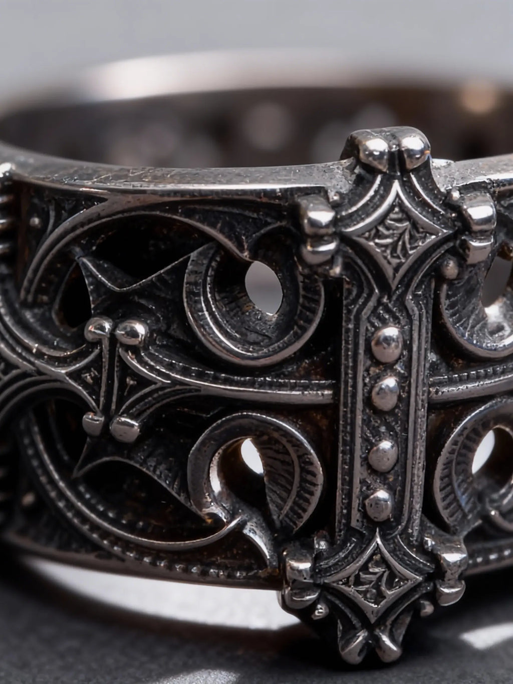 Sanctum Tracery Ring close-up, cruciform centerpiece and pierced tracery detail