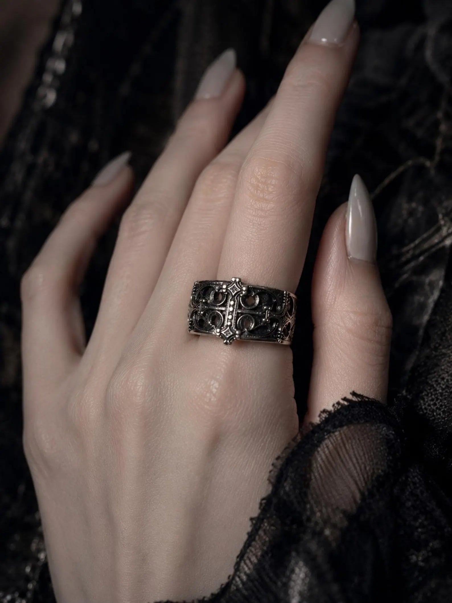 Sanctum Tracery Ring worn on hand with manicured nails, chunky Gothic band