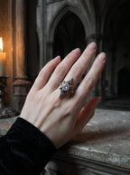 Midnight Star Neo-Gothic ring worn on hand, moissanite stone, in a gothic cathedral setting