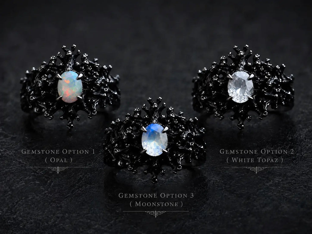 Dark Bloom Ring detail — iridescent oval stone framed by black sterling silver thorns