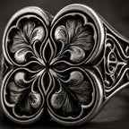 Macro detail of gothic clover ring — hand-engraved quatrefoil leaves in oxidized sterling silver