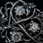 Blackthorn vine ring close-up — chiaroscuro branch patina, textured briars and thorn detail in 925 sterling silver