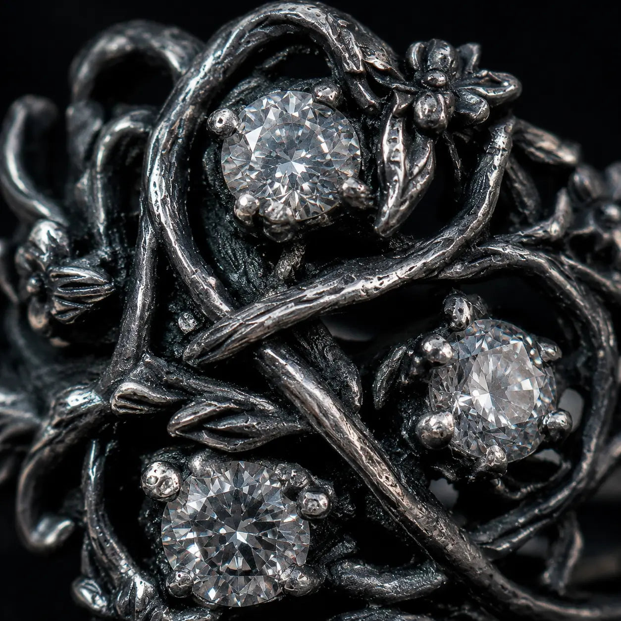 Blackthorn vine ring close-up — chiaroscuro branch patina, textured briars and thorn detail in 925 sterling silver