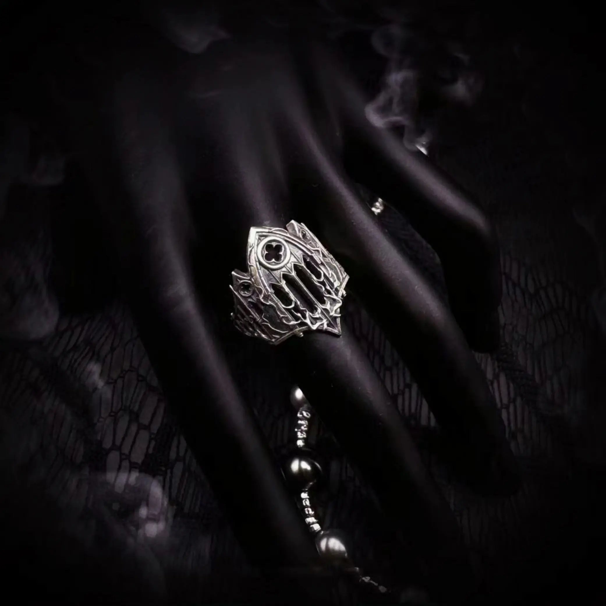 Burning Cathedral ring detail of the pierced Gothic tracery and cut rose window in oxidized silver