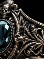 Victorian skull ring close-up — hand-sculpted skull motifs and chiaroscuro oxidized Baroque scrollwork