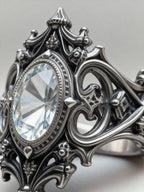 Gothic sanctuary ring side profile — white topaz, architectural spire band with chiaroscuro oxidized finish